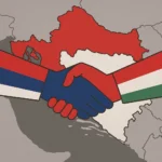 Ilustracija rukovanja koje simbolizira savez Srbija i Mađarska, s njihovim zastavama iznad karte Hrvatske, naglašavajući povijesne pretenzije.